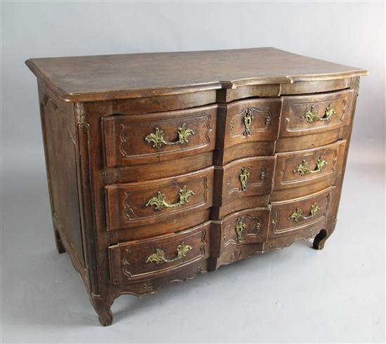 An 18th century French walnut serpentine commode, W.4ft 3in. D.2ft 4in. H.3ft